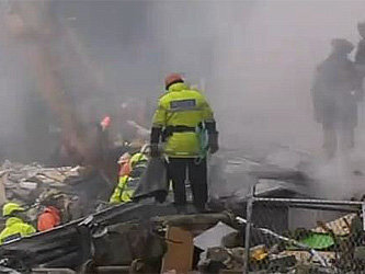 Спасатели, работающие в облаке пыли среди развалин домов в Крайстчерче. Фото с сайта sydneyaffairs.com